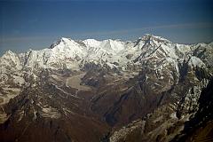 14 Kathmandu Mountain Flight 07-6 Cho Oyu To Gyanchung Kang With Gokyo Valley And Ngozumpa Glacier 1997 A long ice ridge connects Nangpai Gosum I (7351m) to Cho Oyu (8201m) to the little known Gyachung Kang (7952m), the 15th highest mountain in the world. The Gokyo Valley snakes up to the Ngozumpa Glacier, the largest in Nepal. This image is from my first Kathmandu Mountain flight in 1997.